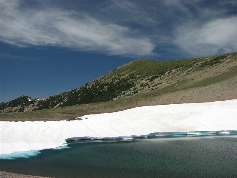 Frozen Lake is the junction for several trails. This lake is the water supply for Sunrise. The snow usually lasts all summer around this lake.