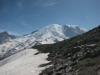 On the trail to Second Burroughs the snow can linger into late July. Mt. Rainier provides a snowy backdrop as the trail climbs up the hillside.