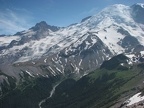 Emmons Glacier and Mt. Tahomoa graces the slopes as Mt. Rainer rises above all else. A branch of the White River flows in the foreground.