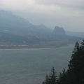 Beacon Rock rises above the Columbia River in the distance to the east. Beacon Rock is in Washington State on the north shore of the Columbia River.