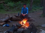 Jeremiah feeds the our campfire at Wy'East Camp.