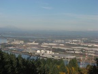 A wider angle of view showing Mt. St. Helens on the left and Mt. Adams on the right, behind the Portland industrial area taken from near the junction of the BPA Road and Fire Lane 13.