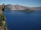 Wizard Island rises above the azure blue water of Crater Lake.