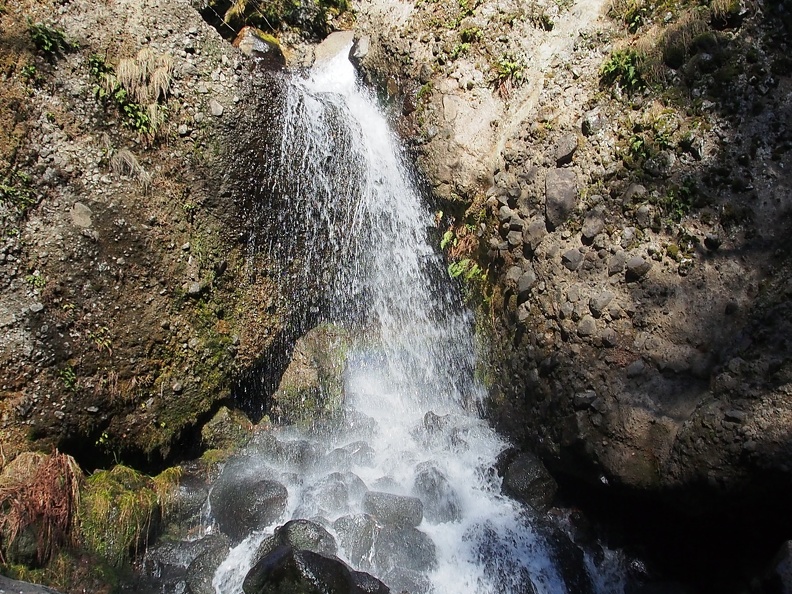 Greenleaf Falls is not a very tall waterfall. It flows down the rocks in two cascades before rushing down the hillside.