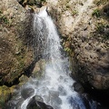 Greenleaf Falls is not a very tall waterfall. It flows down the rocks in two cascades before rushing down the hillside.