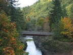 Just upstream from the Footbridge Trailhead for the Wilson River Trail you can see the sturdy footbridge the trail uses to cross the Wilson River.