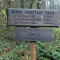 Mileage sign near the trailhead of King's Mountain Trail in the Tillamook State Forest, Oregon.