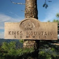 A nicely made sign at the summit King's Mountain in the Tillamook State Forest, Oregon. There is a nearby summit register to sign commemorating reaching the summit.