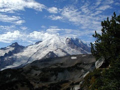 Blue sky and clouds moving in above Mt. Rainier and Burroughs Mountain at Mt. Rainier National Park. 
