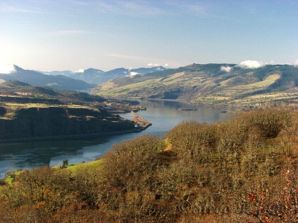 A few puffy clouds look almost like snow on the hills along the Columbia River Gorge.