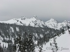 Part of the Tatoosh Range as seen from near Paradise. From left to right, The Castle, Pinnacle Peak, Plummer Peak, Denman Peak.