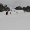 Snowshoers heading up Mazamza Ridge, breaking trail. The snow was becoming heavy and wet as the day warmed up.