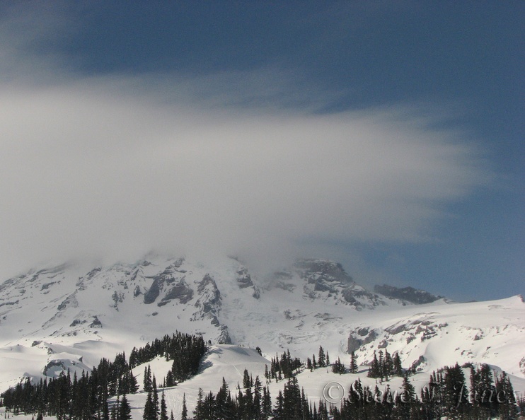 Old Mt. Rainier wearing white spiky hair. 