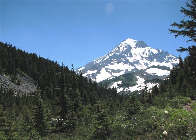 Ridges from Mt. Hood define the landscape at Cairn Basin. The Timberline Trail meets the trail to Eden Park here.
