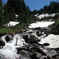 The Timberline Trail crosses McGee Creek on the way to Cairn Basin. 2010 was a late snow year. This photo was taken in late July.