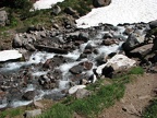 The Timberline Trail crosses McGee Creek on the way to Cairn Basin. 2010 was a late snow year. This photo was taken in late July and shows that there is no bridge over this crossing.