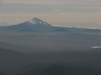 Mt. Jefferson rises above the distant mountains to the south of Mt. Hood.