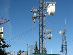 At the summit of Mt. Defiance are several radio towers. Here is a worker doing maintenance on one of the dishes.