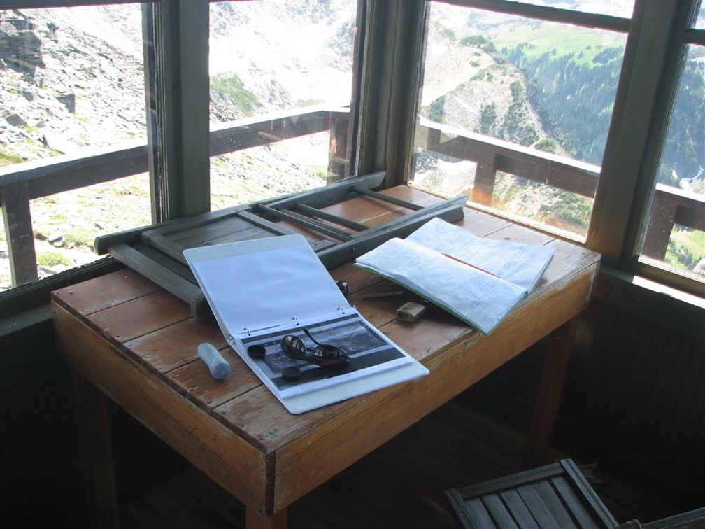 The inside of Mt. Fremont has all the equipment of a fire lookout. It is takes the brunt of winter storms that break windows and have even blown off the roof. During low snow years the rangers have to carry their own water up from Frozen Lake.