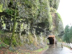 Walking along the very narrow shoulder of the road you soon come to a small portion of the old Columbia River Highway. This shows the restored tunnel at Oneonta Creek. This tunnel is for bikes and foot traffic only.