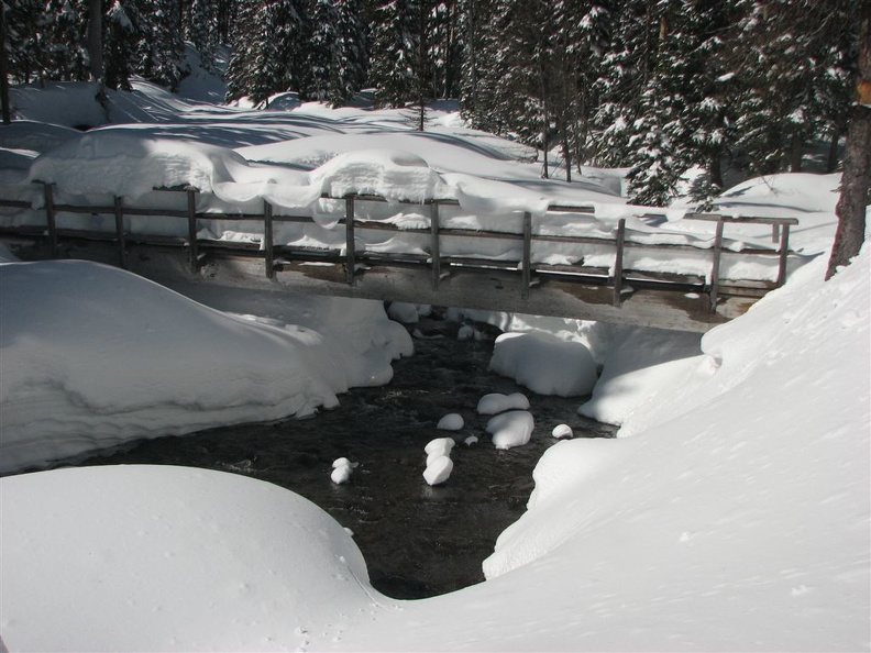 The log bridge over Clark Creek is so full of snow that it isn't useable until some of the snow melts. There are usually snow bridges just upstream from the bridge that are used.