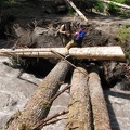 Flood damage along the West Fork of the White River on the Northern Loop Trail where the river has carved a new main channel. Zach is stepping across the old bridge.