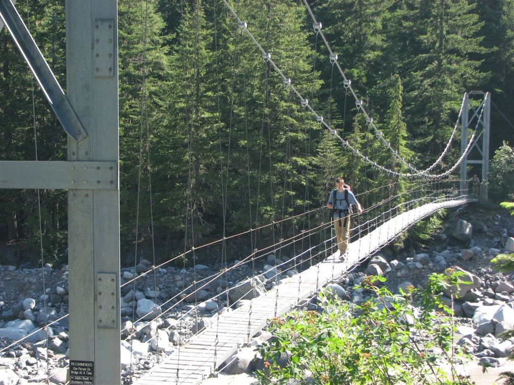 Zach crossing the suspension bridge over the Carbon River near Carbon River Camp. This is always one of the highlights of the trip because we always take a break at the west end of the bridge in the shade.
