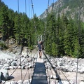 Steve crossing the suspension bridge over the Carbon River near Carbon River Camp. I'm looking foward to the food break we always take at the west end of the bridge, in the shade.