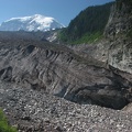 The Carbon Glacier ends at the lowest elevation of any glacier in the United States, except for Alaska. The Winthrop Glacier has to end just about at the same elevation. Mt. Rainier is the white dome in the background.