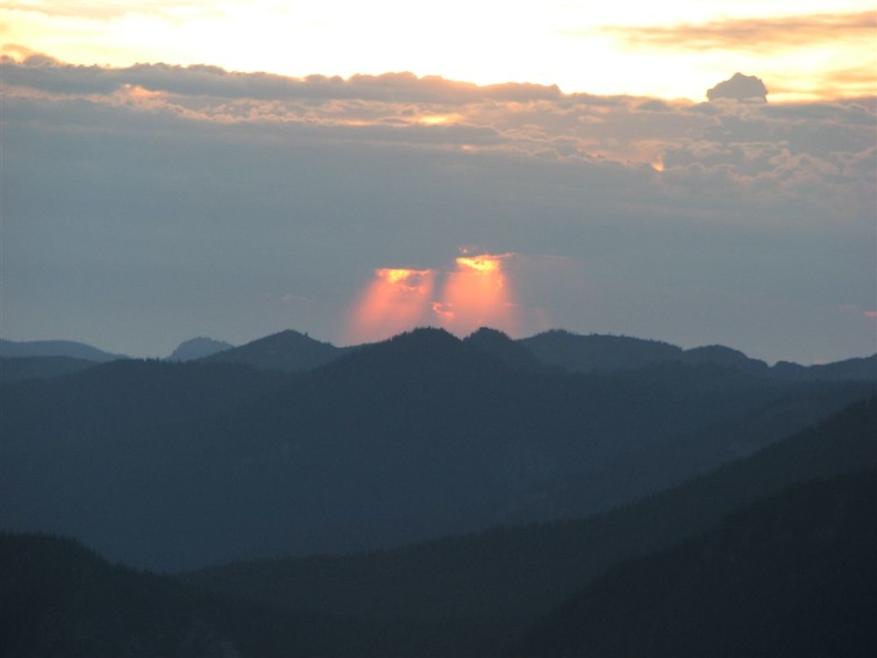 The rising sun pours through two small breaks in the clouds in the east. These clouds later turned into thunderstorms but they never made it to the park.