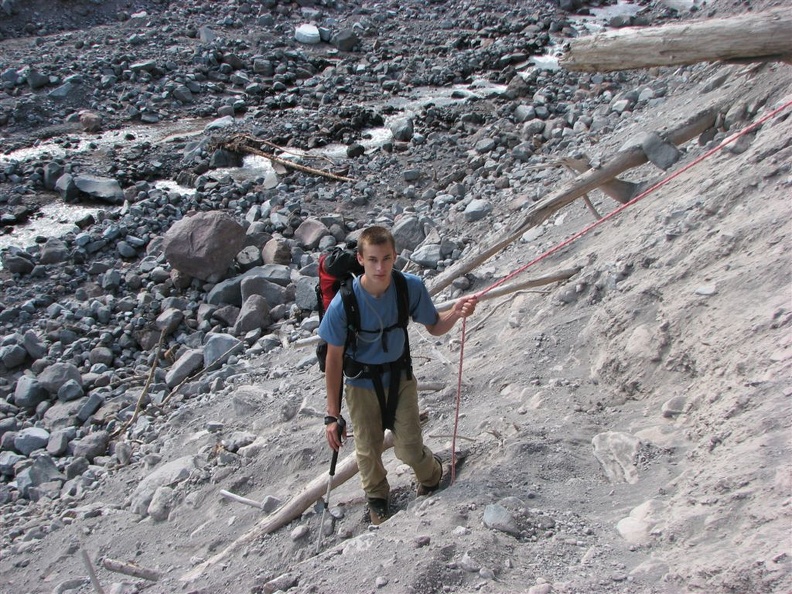 Zach using a rope to descend the Wonderland Trail near Winthrop Creek.