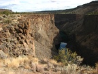 The Crooked River is the main attraction of this hike. The vegetation in the area is sparse and brushy.