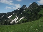 Meadows of flowers frame the Cowlitz Chimneys above the Owyhigh Trail.