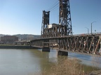 Portland East Bank Espalnade Steel Bridge. The Steel Bridge is unique in that the lower deck can be raised while leaving the upper deck in place, or both decks can be raised.