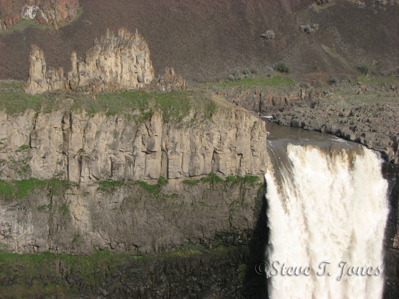 Palouse Falls plunges over a basalt precipice and makes quite a show in the spring. This is from the parking lot.
