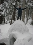 The weather was cold enough to freeze the snow blocks together and I am able to stand on top of the igloo.
