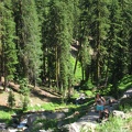 Hikers pause to take a break along the Plaikni Falls Trail in Crater Lake National Park.