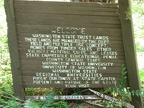 An old Department of Natural Resources sign slowly falls apart just downhill of the trail near where it meets the Pacific Crest Trail.