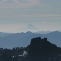 Mt. Hood in the distance and mountains of the Tatoosh Range from Panorama Point at Mt. Rainier National Park.
