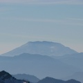 Mt. St. Helens in the distance and mountains of the Tatoosh Range from Panorama Point at Mt. Rainier National Park.