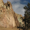 A few trees grow along the Crooked River as it wraps around Smith Rock State Park. The texture and colors of the rocks are constantly changing as you walk along the trail.