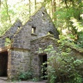 The stone house is at the junction of the Lower Macleay Trail and the Wildwood Trail. Though it is picturesque sometimes people leave trash around the house.