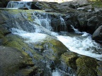 Water cascades down a small waterfall along Sweet Creek Trail.