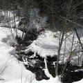 A small stream flows through a culvert under the trail at the bottom of the hill, about .5 mile from the parking lot on the Trillium Lake Trail.