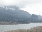 An overlook from the Horsetail Creek Trail with Beacon Rock is in the distance on the right and looks kind of like a big tooth. Wind Mountain is the pointy peak just to the right and behind Beacon Rock.