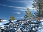 Whispy clouds and frosty rocks provide a wintery scene on the shady side of the ridge. This is on a promontory west of the Pacific Crest Trail on the way to Twin Lakes Trail.