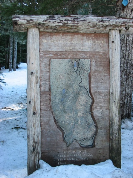 An old trail sign showing the PCT at the Barlow Pass Trailhead.