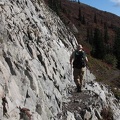 Brad easily navigates one of the stretches of trail that has been blasted out of the rock along the Boundary Trail.