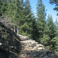 The Wind Mountain trail crosses a rocky scree field, providing views to the east.
