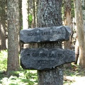 A rustic trail sign showing the side trail to North Lake on the Wyeth Trail.